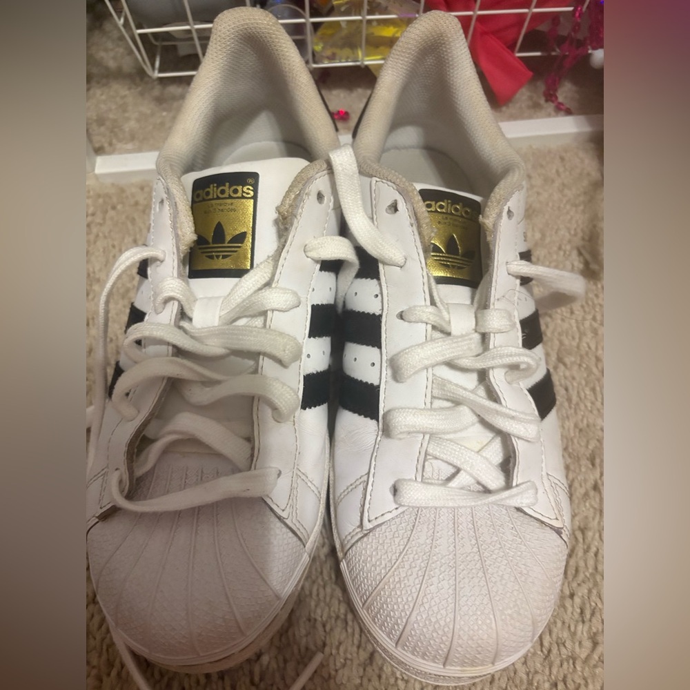 Adidas Classic White Sneakers with Black Stripes and Gold Logo